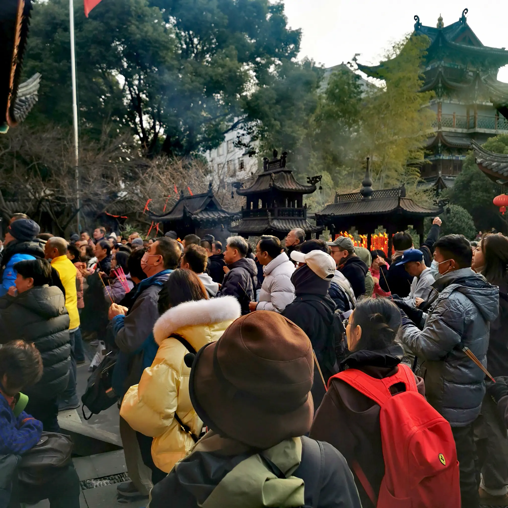 Visitors gathered at a Chinese temple during a Zen retreat journey